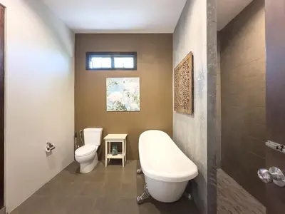 a bathroom with a toilet and a tub and a sink at Villa Intira 5 bedrooms with 12m private pool and garden in Rawai Beach