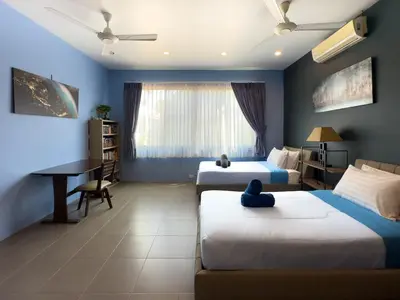 a hotel room with two beds and a desk at Villa Intira 5 bedrooms with 12m private pool and garden in Rawai Beach