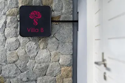 a sign for a villa b on a stone wall at New Years Super Fancy 2br Villa near Cafe Del Mar in Kamala Beach