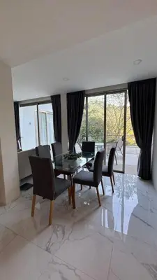 a dining room with a glass table and chairs at New Years Super Fancy 2br Villa near Cafe Del Mar in Kamala Beach