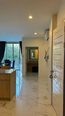 a living room with a kitchen and a dining room at New Years Super Fancy 2br Villa near Cafe Del Mar in Kamala Beach