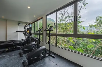 a room with a gym with a exercise bike at C169 Part of the famous Fantasea Kamala in Kamala Beach