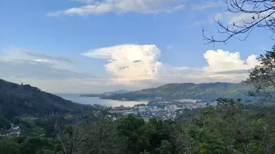 a view of a city and a body of water at Tiger Nanai guest house in Patong Beach