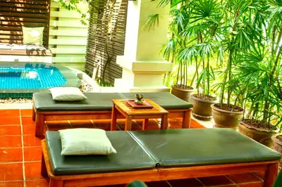a patio with green benches and a swimming pool at Rose Pool Villa The perfect private oasis in Rawai Beach