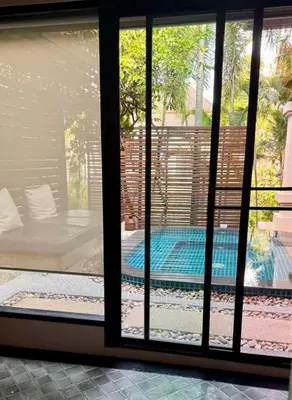 a view of a swimming pool through a window at Rose Pool Villa The perfect private oasis in Rawai Beach