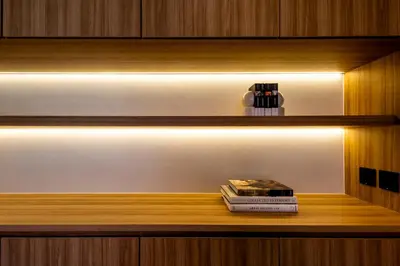 a shelf with a book and a candle on it at Luxury 4 Bedroom Villa 1 Minute from Laguna Phuket in Bang Tao Beach