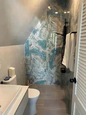 a bathroom with a sink and a toilet at Rawai Beach studio in Nai Harn Beach