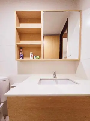 a bathroom with a sink and a mirror at The feeltrue phuket CK in Phuket Town