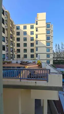 a view of a building with a deck and a building at The feeltrue phuket CK in Phuket Town