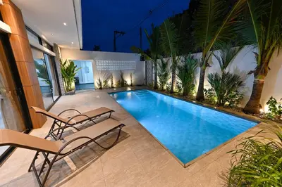 a swimming pool with two lounge chairs on a patio at Diamond 2 Villa by G Estate Phuket in Ban Saiyuan (1)