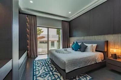 a bedroom with a bed and a large window at Luxury Seaview Villa 6BR - Villa Shine in Ban Saiyuan (1)