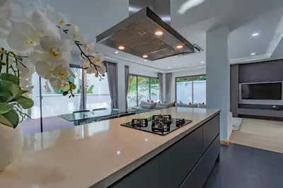 a kitchen with a large island with a counter top at Luxury Seaview Villa 6BR - Villa Shine in Ban Saiyuan (1)