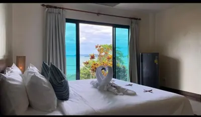 a bedroom with a bed with a swan decoration on it at Pool Villa Ao Pro in Ban Ao Kung