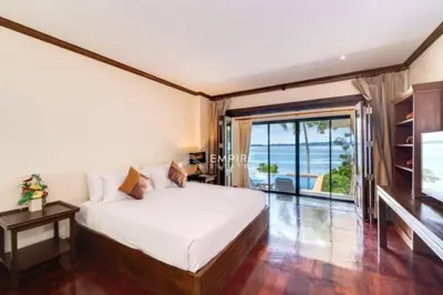 a bedroom with a bed and a large window at Pool Villa Ao Pro in Ban Ao Kung