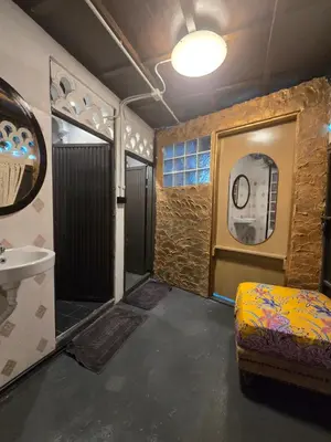 a bathroom with a shower and a sink and a toilet at Little Home in Town in Ban Lo Long