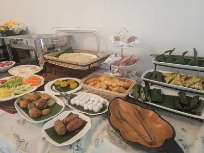 a table with many different types of food on it at Esmeralda View Resort - SHA Extra Plus in Ko Yao Yai