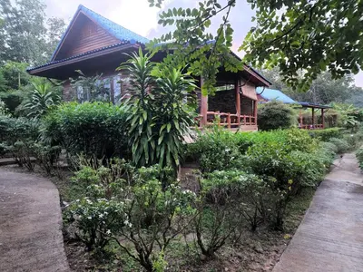a house with a garden in front of it at Esmeralda View Resort - SHA Extra Plus in Ko Yao Yai