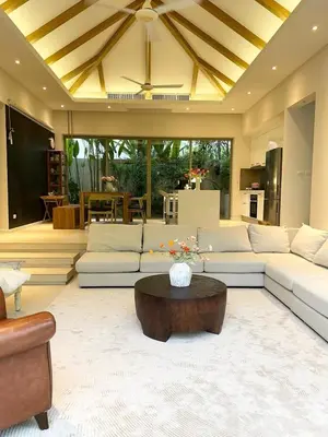 a living room with a couch and a coffee table at V164 Famous 5 Trichada Resort 4-Bedroom in Thalang