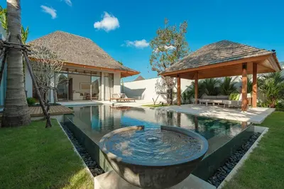 a pool with a fountain in the yard of a house at V165 Famous Anchan Flora 4 BR in Thalang