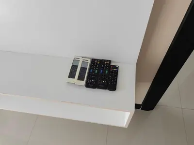 a remote control sitting on top of a white counter at Maikhao Beach Condominium in Mai Khao Beach