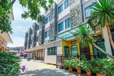 a building with plants in front of it at The Little Nest Phuket in Phuket Town