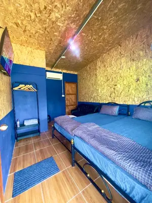 a bedroom with two beds in a room at Lamai home 4 in Ko Yao Noi