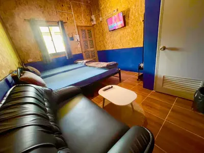 a living room with a couch and a table at Lamai home 4 in Ko Yao Noi