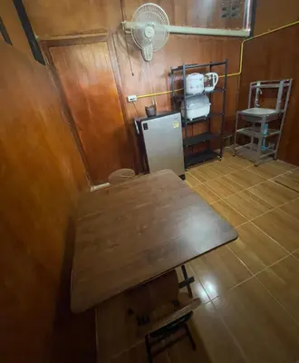 an overhead view of a kitchen with a table and a refrigerator at Lamai home 4 in Ko Yao Noi