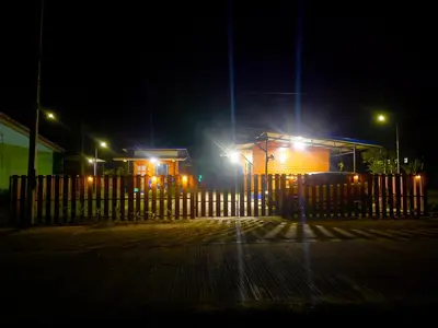 a gas station at night with lights on at Lamai home 4 in Ko Yao Noi