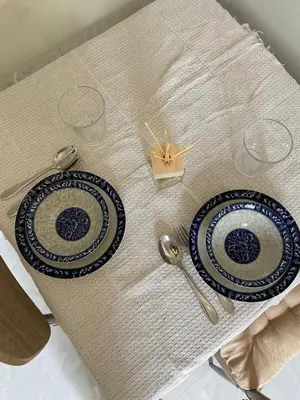 two blue and white plates on a table at Detached house Rawai beach in Ban Saiyuan (1)