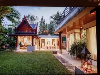 a house with a gazebo in the yard at Villa in the Park, Surin Beach, Phuket in Surin Beach