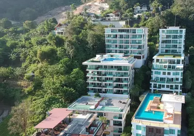 an aerial view of tall buildings on a hill at Spacious apartment with ocean view & jacuzzi in Patong Beach