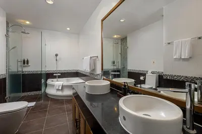 a bathroom with three sinks and two toilets at 3BR Suite Surin Beach Phuket - Near 2 beaches in Surin Beach