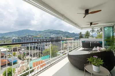 a balcony with a view of a city at 3BR Suite Surin Beach Phuket - Near 2 beaches in Surin Beach