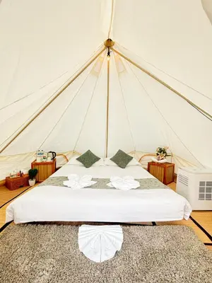 a bedroom with a bed in a tent at Thailand Mountain Phuket in Patong Beach