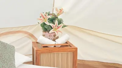 a vase with a plant on top of a table at Thailand Mountain Phuket in Patong Beach