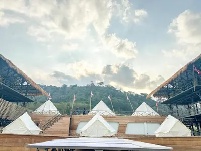 a group of white tents in front of a stadium at Thailand Mountain Phuket in Patong Beach