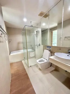 a bathroom with a shower and a toilet and a sink at 1 bedroom walk to Kalim in Patong Beach