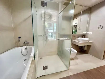 a bathroom with a shower and a toilet and a sink at 1 bedroom walk to Kalim in Patong Beach
