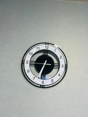 a clock is hanging on a wall at Pool View Apartments-Kathu,Phuket in Kathu