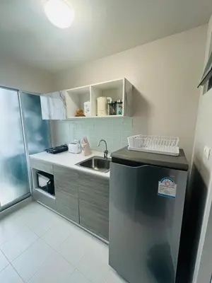 a small kitchen with a sink and a refrigerator at Pool View Apartments-Kathu,Phuket in Kathu
