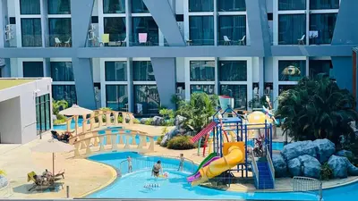 a water park in front of a building at Utopia Loft Condo in Nai Harn Beach