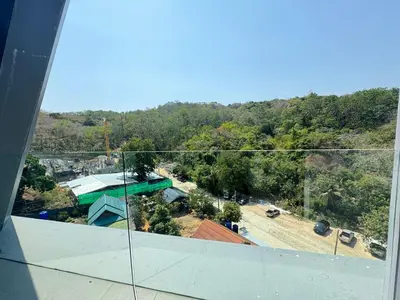 a view from the top of a building with a mountain at Utopia Loft Condo in Nai Harn Beach