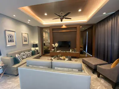 a living room with a couch and a ceiling fan at villa kamala regent 2 bedrooms in Kamala Beach