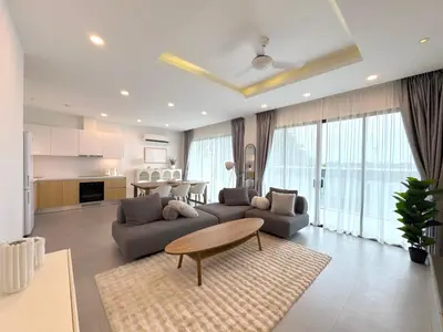 a living room with two couches and a table at Luxury 3BR Triplex Jacuzzi & Sea View PANDORA RESIDENCES in Nai Harn Beach