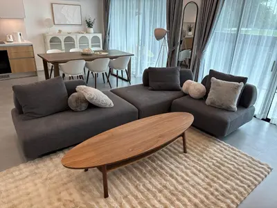 a living room with a couch and a table at Luxury 3BR Triplex Jacuzzi & Sea View PANDORA RESIDENCES in Nai Harn Beach