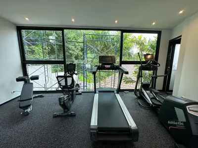a gym with treadmills and machines in a room at Luxury 3BR Triplex Jacuzzi & Sea View PANDORA RESIDENCES in Nai Harn Beach