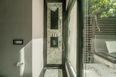 a bathroom with a shower with a glass door at Rose Pool Villa The perfect private oasis in Rawai Beach
