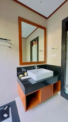 a bathroom with a sink and a mirror at Rose Pool Villa The perfect private oasis in Rawai Beach