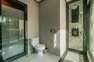 a bathroom with a toilet and a walk in shower at Rose Pool Villa The perfect private oasis in Rawai Beach